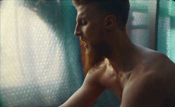 Movie still from “Andrzej Mrozek - Międzysmak” (2019), directed by Łukasz Zabłocki – Close Up shot, Low angle