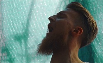 Movie still from “Andrzej Mrozek - Międzysmak” (2019), directed by Łukasz Zabłocki – Close Up shot, Low angle