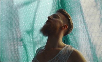 Movie still from “Andrzej Mrozek - Międzysmak” (2019), directed by Łukasz Zabłocki – Close Up shot, Low angle