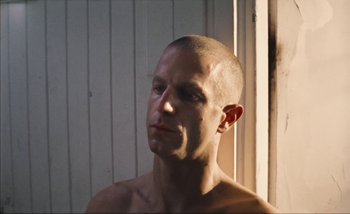 Movie still from “Andrzej Mrozek - Międzysmak” (2019), directed by Łukasz Zabłocki – Close Up shot, Low angle