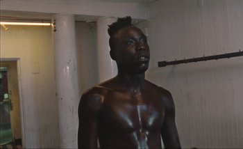 Movie still from “Andrzej Mrozek - Międzysmak” (2019), directed by Łukasz Zabłocki – Medium shot, Low angle