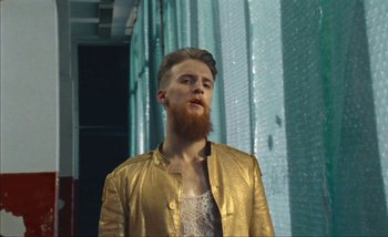 Movie still from “Andrzej Mrozek - Międzysmak” (2019), directed by Łukasz Zabłocki – Medium shot, Low angle