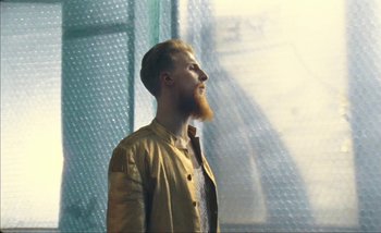 Movie still from “Andrzej Mrozek - Międzysmak” (2019), directed by Łukasz Zabłocki – Close Up shot, Low angle