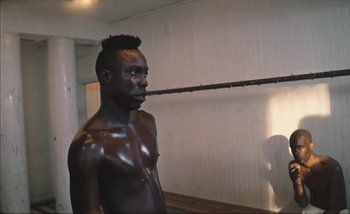 Movie still from “Andrzej Mrozek - Międzysmak” (2019), directed by Łukasz Zabłocki – Medium shot, Low angle