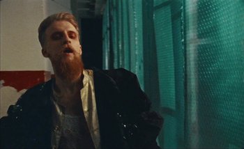 Movie still from “Andrzej Mrozek - Międzysmak” (2019), directed by Łukasz Zabłocki – Medium shot, Low angle