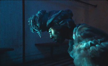 Movie still from “Andrzej Mrozek - Międzysmak” (2019), directed by Łukasz Zabłocki – Medium shot, Low angle