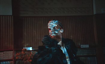 Movie still from “Andrzej Mrozek - Międzysmak” (2019), directed by Łukasz Zabłocki – Close Up shot, Low angle