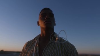 Movie still from “Jordan Hawkins - Lost feat. oghosthaze” (2019), directed by Henry Kinder – Medium shot, Low angle