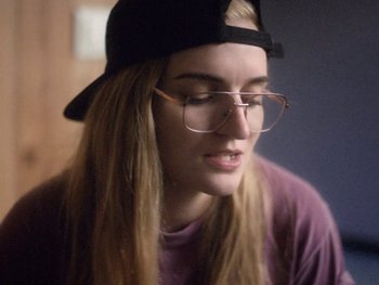 Movie still from “G FLIP - I Am Not Afraid” (2019), directed by Lucy Knox – Close Up shot, Over the shoulder angle