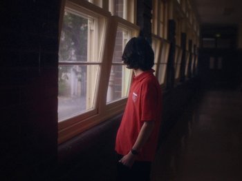 Movie still from “G FLIP - I Am Not Afraid” (2019), directed by Lucy Knox – Medium shot, Low angle