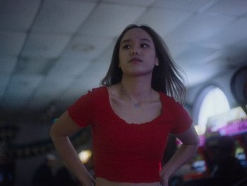 Movie still from “G FLIP - I Am Not Afraid” (2019), directed by Lucy Knox – Medium shot, Low angle