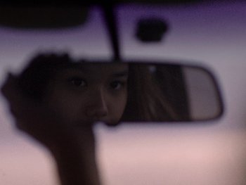 Movie still from “G FLIP - I Am Not Afraid” (2019), directed by Lucy Knox – Extreme Close Up shot, Over the shoulder angle
