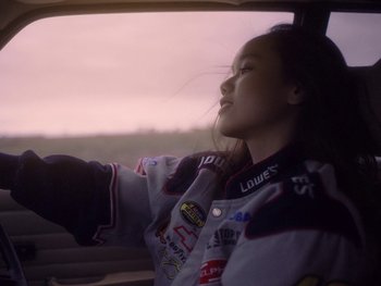 Movie still from “G FLIP - I Am Not Afraid” (2019), directed by Lucy Knox – Medium shot, Low angle
