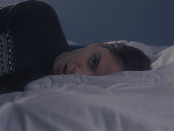 Movie still from “Gracie Gray - Morphine” (2019), directed by Michael Priestley – Extreme Close Up shot, High angle
