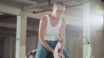 Movie still from “Clare Bowditch - Woman” (2019), directed by Lucy Knox – Medium shot, Low angle