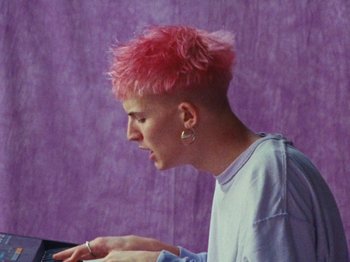 Movie still from “Gus Dapperton - Fill Me Up Anthem” (2019), directed by Gus Dapperton – Close Up shot, High angle