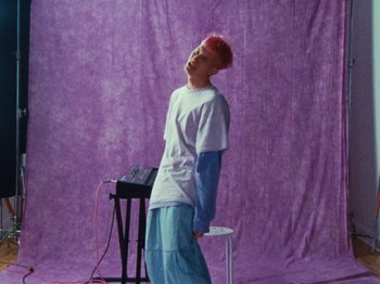 Movie still from “Gus Dapperton - Fill Me Up Anthem” (2019), directed by Gus Dapperton – Medium shot, High angle