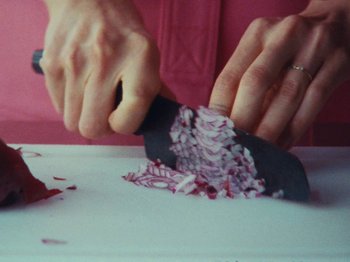 Movie still from “Gus Dapperton - Fill Me Up Anthem” (2019), directed by Gus Dapperton – Extreme Close Up shot, Overhead angle