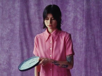 Movie still from “Gus Dapperton - Fill Me Up Anthem” (2019), directed by Gus Dapperton – Medium shot, High angle