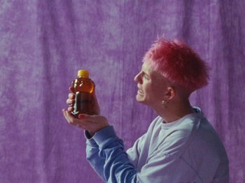 Movie still from “Gus Dapperton - Fill Me Up Anthem” (2019), directed by Gus Dapperton – Medium shot, High angle