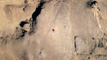 Movie still from “Petite Noir’s La Maison Noir” (2019), directed by Rharha Nembhard – Extreme Wide shot, Overhead angle
