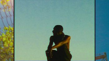 Movie still from “Huey Briss - Regardless” (2019), directed by Michael Priestley – Medium shot, Low angle