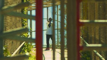 Movie still from “Huey Briss - Regardless” (2019), directed by Michael Priestley – Medium shot, Low angle
