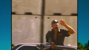Movie still from “Huey Briss - Regardless” (2019), directed by Michael Priestley – Medium shot, Low angle