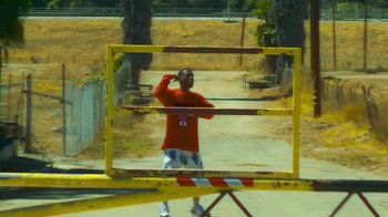 Movie still from “Huey Briss - Regardless” (2019), directed by Michael Priestley – Wide shot, High angle
