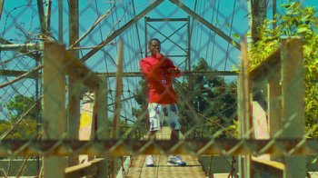 Movie still from “Huey Briss - Regardless” (2019), directed by Michael Priestley – Medium shot, Low angle