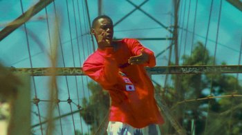 Movie still from “Huey Briss - Regardless” (2019), directed by Michael Priestley – Medium shot, Low angle
