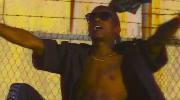 Movie still from “Huey Briss - Regardless” (2019), directed by Michael Priestley – Medium shot, Low angle