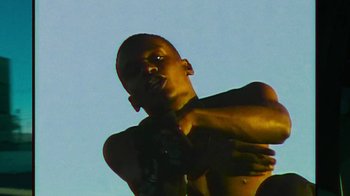 Movie still from “Huey Briss - Regardless” (2019), directed by Michael Priestley – Close Up shot, Low angle