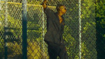 Movie still from “Huey Briss - Regardless” (2019), directed by Michael Priestley – Medium shot, Low angle