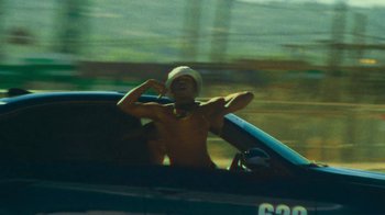 Movie still from “Huey Briss - Regardless” (2019), directed by Michael Priestley – Medium shot, Low angle