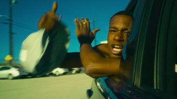 Movie still from “Huey Briss - Regardless” (2019), directed by Michael Priestley – Medium shot, Low angle