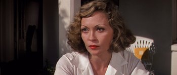 Movie still from “Chinatown” (1974), directed by Roman Polanski – A person wearing a white shirt; Close Up shot, High angle