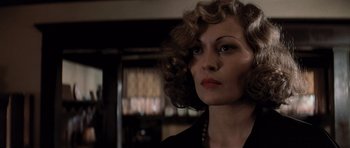 Movie still from “Chinatown” (1974), directed by Roman Polanski – A person with curly hair; Close Up shot, Low angle