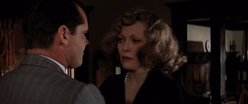 Movie still from “Chinatown” (1974), directed by Roman Polanski – A man and a woman talking to each other; Close Up shot, Over the shoulder angle