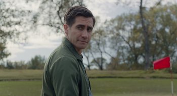 Movie still from “Wildlife” (2018), directed by Paul Dano – A person wearing a green shirt; Close Up shot, Over the shoulder angle