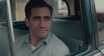 Movie still from “Wildlife” (2018), directed by Paul Dano – A person sitting in a car; Close Up shot, Over the shoulder angle