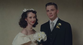 Movie still from “Wildlife” (2018), directed by Paul Dano – A man and a woman posing for a wedding picture; Close Up shot, Low angle