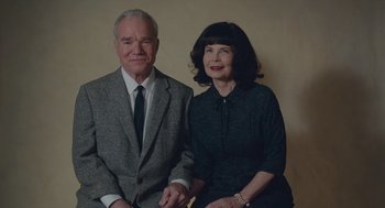 Movie still from “Wildlife” (2018), directed by Paul Dano – An older man and woman posing for a picture; Medium shot, High angle