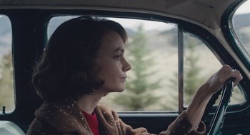 Movie still from “Wildlife” (2018), directed by Paul Dano – A woman sitting in the driver's seat of a car; Close Up shot, Over the shoulder angle