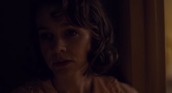 Movie still from “Wildlife” (2018), directed by Paul Dano – A person looking at the camera; Close Up shot, Over the shoulder angle