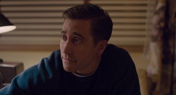 Movie still from “Wildlife” (2018), directed by Paul Dano – A person sitting in front of a window; Close Up shot, Over the shoulder angle