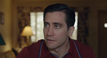 Movie still from “Wildlife” (2018), directed by Paul Dano – A person wearing a red shirt; Close Up shot, Over the shoulder angle