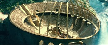 Movie still from “Wonder Woman 1984” (2020), directed by Patty Jenkins – An aerial view of an arena with people sitting in it; Extreme Wide shot, High angle