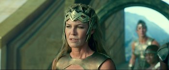 Movie still from “Wonder Woman 1984” (2020), directed by Patty Jenkins – A person wearing a costume; Close Up shot, Over the shoulder angle