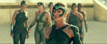 Movie still from “Wonder Woman 1984” (2020), directed by Patty Jenkins – A group of women dressed in costume for a movie; Medium shot, Low angle